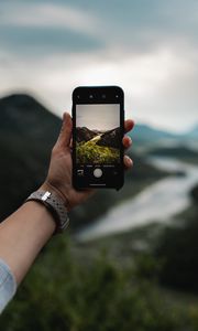 Preview wallpaper phone, hand, river, nature