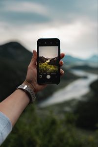 Preview wallpaper phone, hand, river, nature