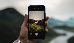 Preview wallpaper phone, hand, river, nature