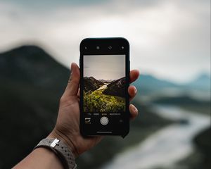 Preview wallpaper phone, hand, river, nature