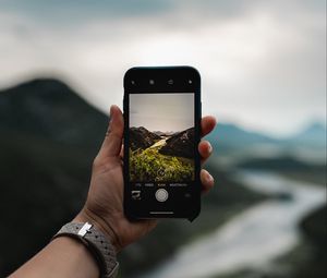 Preview wallpaper phone, hand, river, nature