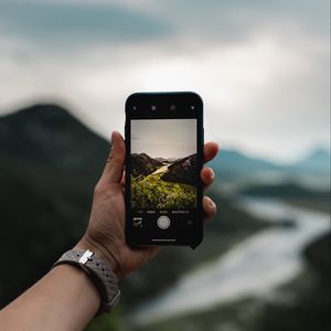 Preview wallpaper phone, hand, river, nature