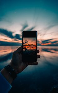 Preview wallpaper phone, hand, sunset, horizon