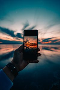 Preview wallpaper phone, hand, sunset, horizon