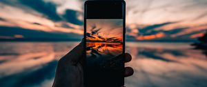 Preview wallpaper phone, hand, sunset, horizon