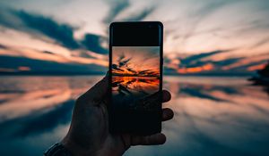 Preview wallpaper phone, hand, sunset, horizon