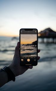 Preview wallpaper phone, hand, sunset, shooting