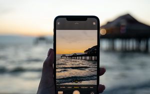Preview wallpaper phone, hand, sunset, shooting