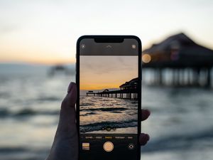 Preview wallpaper phone, hand, sunset, shooting
