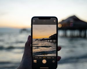 Preview wallpaper phone, hand, sunset, shooting