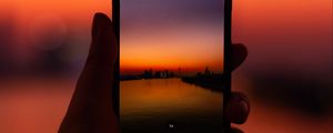 Preview wallpaper phone, hand, sunset, twilight, photo
