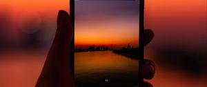 Preview wallpaper phone, hand, sunset, twilight, photo