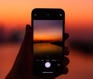 Preview wallpaper phone, hand, sunset, twilight, photo