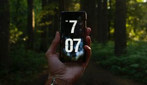 Preview wallpaper phone, hand, time, forest, trees