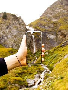 Preview wallpaper phone, hand, waterfall, landscape, shooting