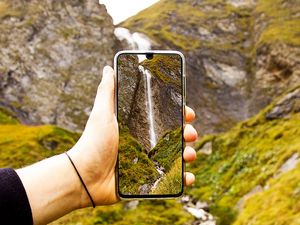 Preview wallpaper phone, hand, waterfall, landscape, shooting