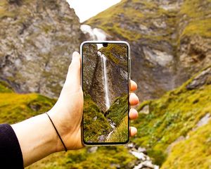 Preview wallpaper phone, hand, waterfall, landscape, shooting