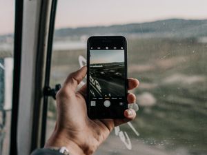 Preview wallpaper phone, hand, window, photo, focus