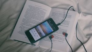 Preview wallpaper phone, headphones, book