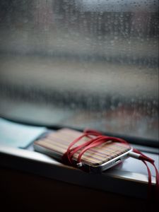 Preview wallpaper phone, headphones, device, music, window, rain