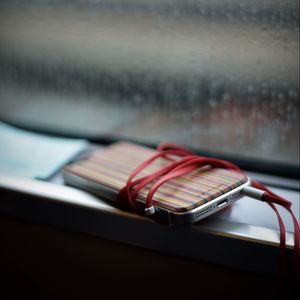 Preview wallpaper phone, headphones, device, music, window, rain