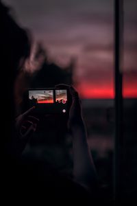 Preview wallpaper phone, shooting, hands, sunset, dark