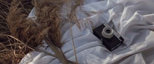 Preview wallpaper photo camera, retro, grass, dry, fabric, white