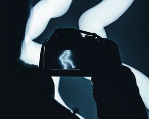 Preview wallpaper photographer, camera, rabbit, neon, dark