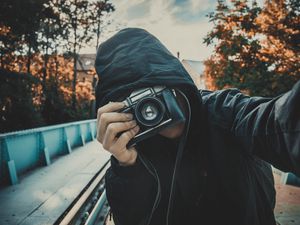 Preview wallpaper photographer, camera, selfie, hood, lens, hidden face