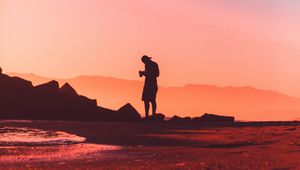 Preview wallpaper photographer, lonely, silhouette, sunset, pink