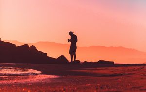 Preview wallpaper photographer, lonely, silhouette, sunset, pink