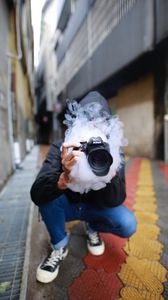 Preview wallpaper photographer, smoke, camera, hand