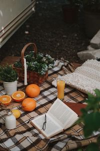 Preview wallpaper picnic, book, orange, flowers