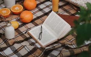 Preview wallpaper picnic, book, orange, flowers