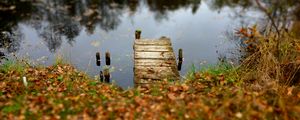 Preview wallpaper pier, autumn, river, fallen leaves