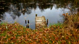 Preview wallpaper pier, autumn, river, fallen leaves