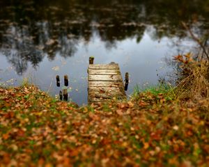Preview wallpaper pier, autumn, river, fallen leaves