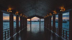 Preview wallpaper pier, boardwalk, ocean, palm trees, evening