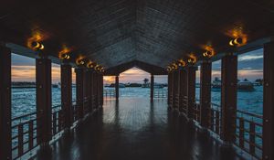 Preview wallpaper pier, boardwalk, ocean, palm trees, evening