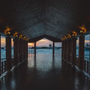 Preview wallpaper pier, boardwalk, ocean, palm trees, evening