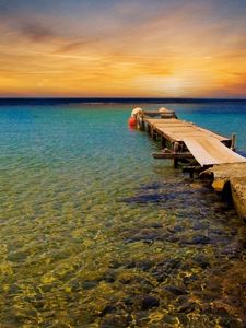 Preview wallpaper pier, breakwater, sea, decline, evening, yacht, horizon, water, transparent