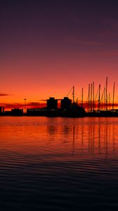 Preview wallpaper pier, buildings, boats, silhouettes, water, sunset, dark