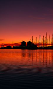 Preview wallpaper pier, buildings, boats, silhouettes, water, sunset, dark