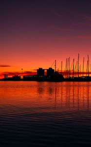 Preview wallpaper pier, buildings, boats, silhouettes, water, sunset, dark