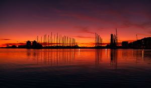 Preview wallpaper pier, buildings, boats, silhouettes, water, sunset, dark