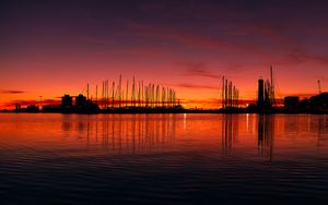 Preview wallpaper pier, buildings, boats, silhouettes, water, sunset, dark