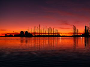 Preview wallpaper pier, buildings, boats, silhouettes, water, sunset, dark