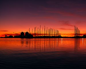 Preview wallpaper pier, buildings, boats, silhouettes, water, sunset, dark