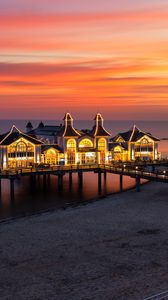 Preview wallpaper pier, buildings, lights, illumination, sea, beach