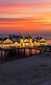 Preview wallpaper pier, buildings, lights, illumination, sea, beach